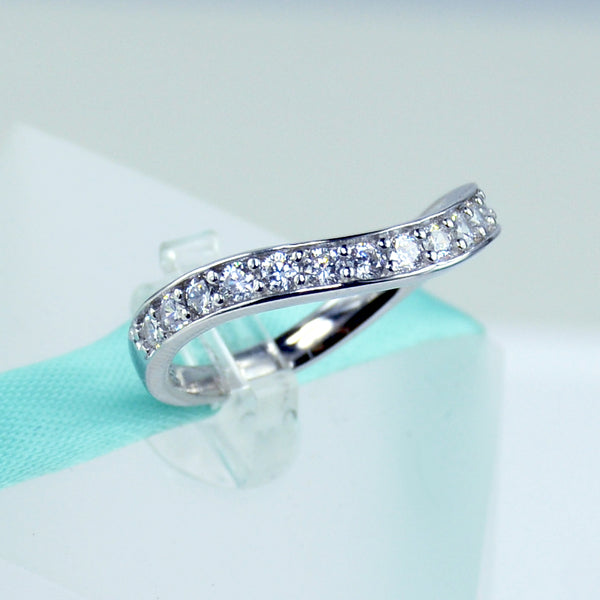 Curved cubic zirconia wedding on sale band